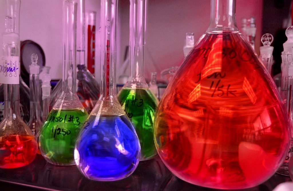 Laboratory flasks filled with coloured reagents